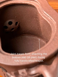 Joint traces from attaching the bottom slab (di pian) during fully handcrafted teapot.