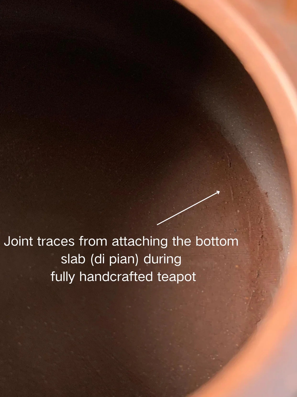 Joint traces from attaching the bottom slab (di pian) during fully handcrafted teapot.