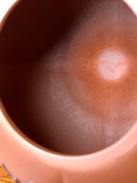 Close up photo of marks left by hand tools inside a teapot