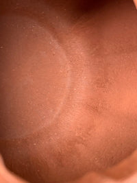 Close-up photo of the tool marks left inside a handmade teapot.