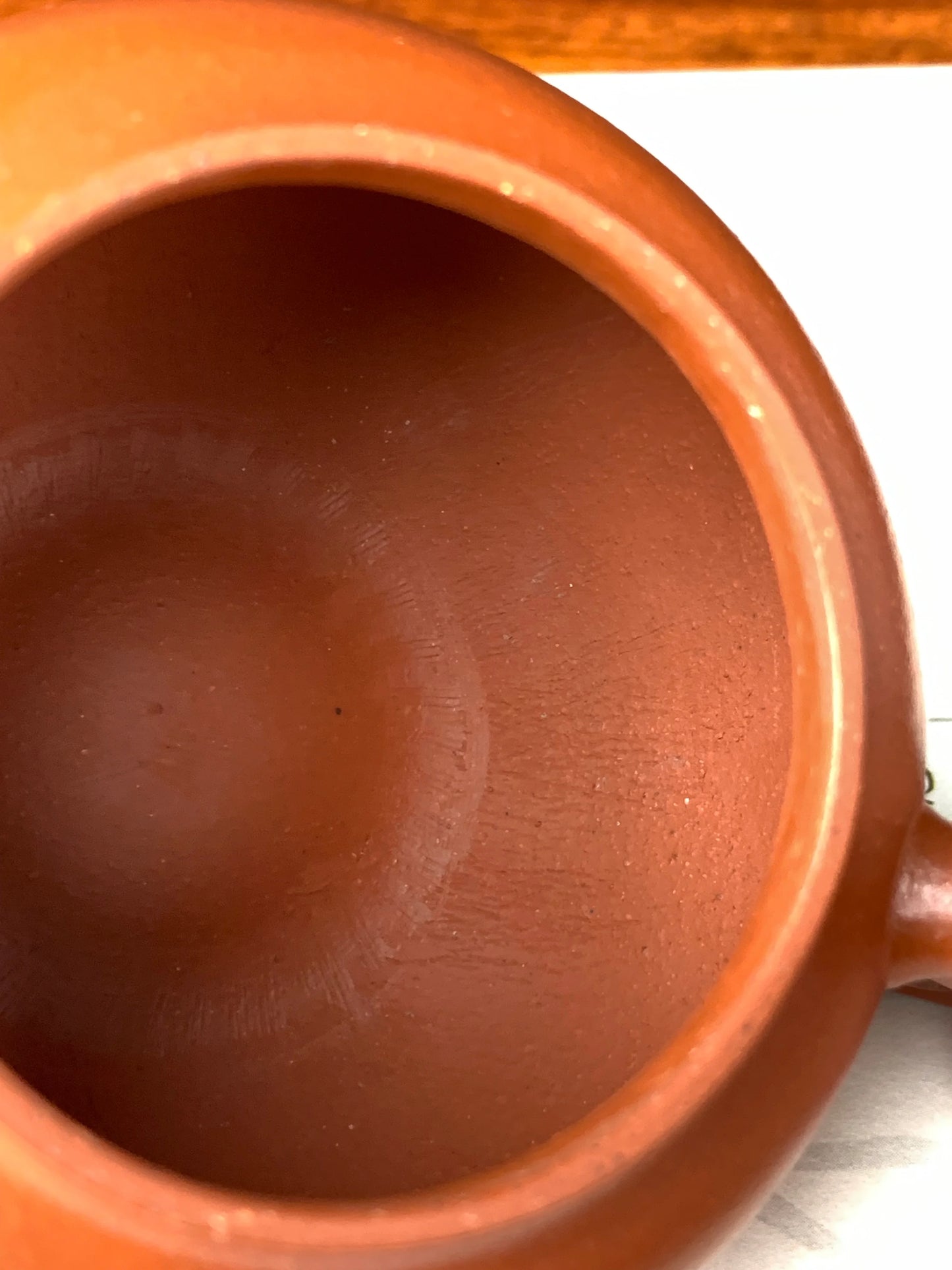 Inside the teapot, you can see traces left from fully hand‑making