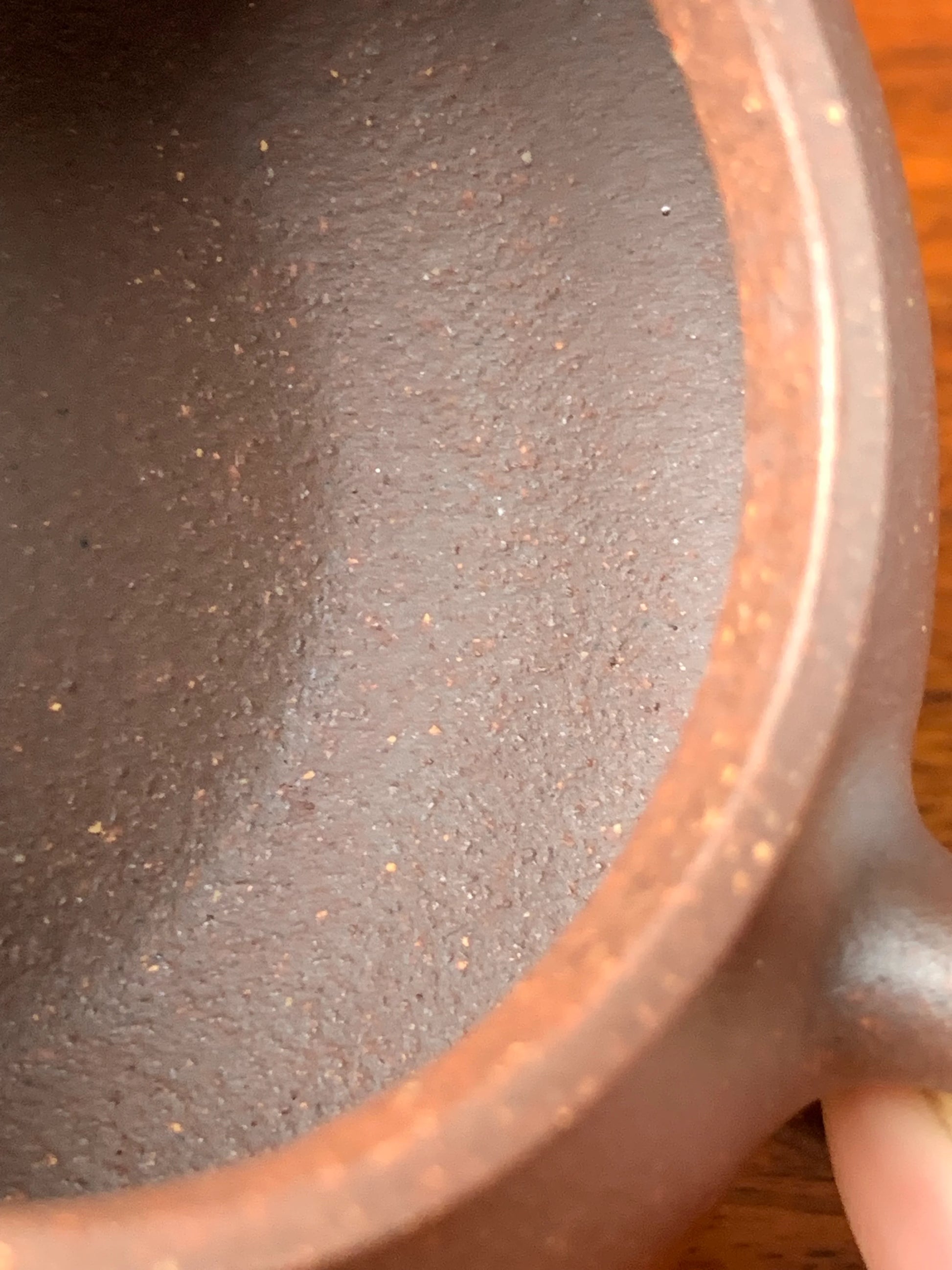 The handmade traces on the interior of the teapot