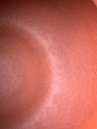 Tool marks left by handcrafting on the interior of the teapot