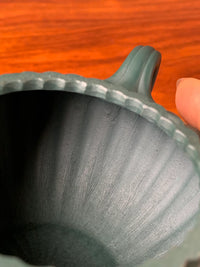 The tool marks left on the interior of the teapot after it was fully handmade