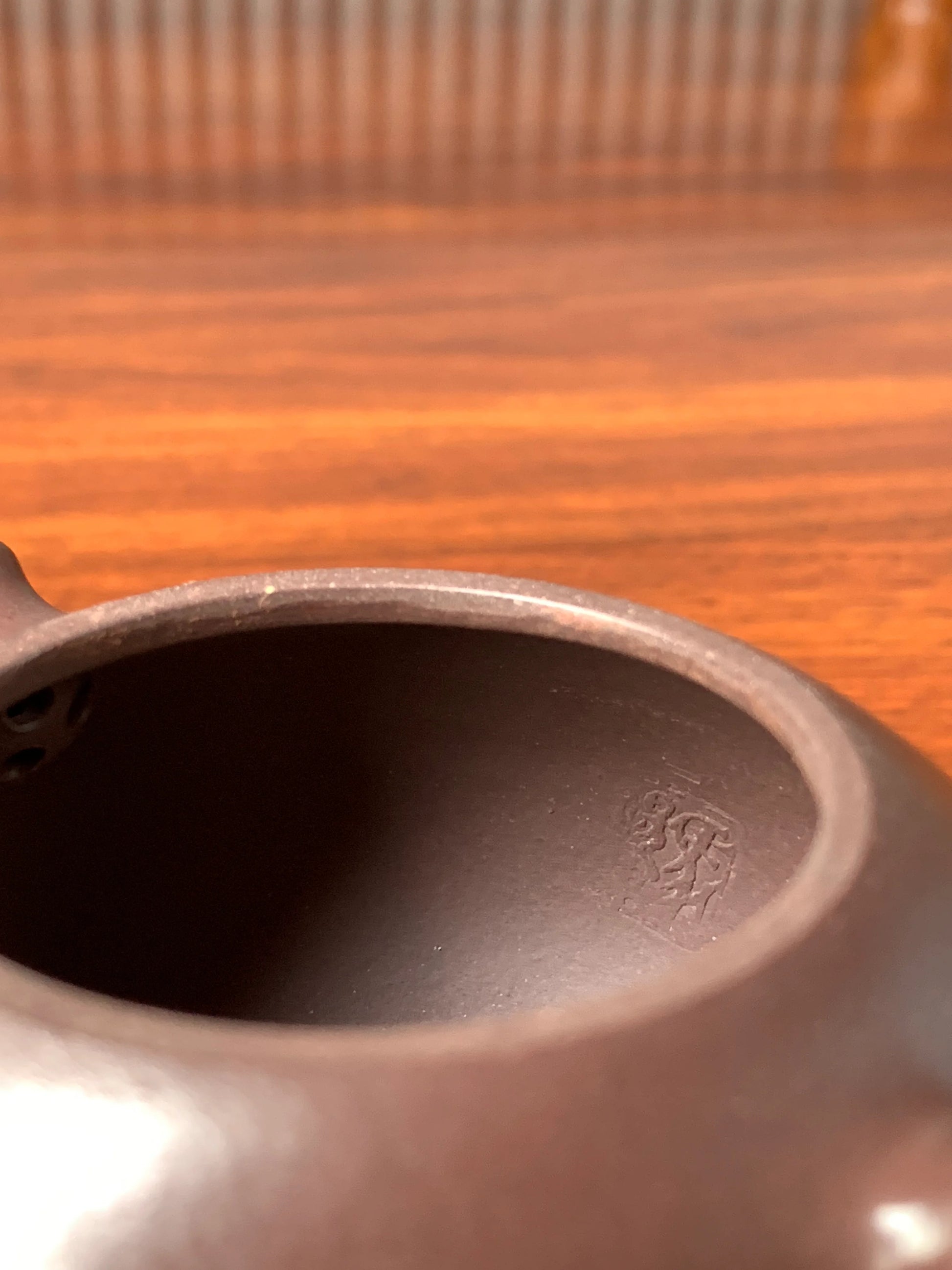 An interior seal is impressed on the inner wall of the zisha teapot