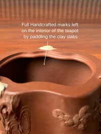 full handmade marks left on the interior of the teapot
