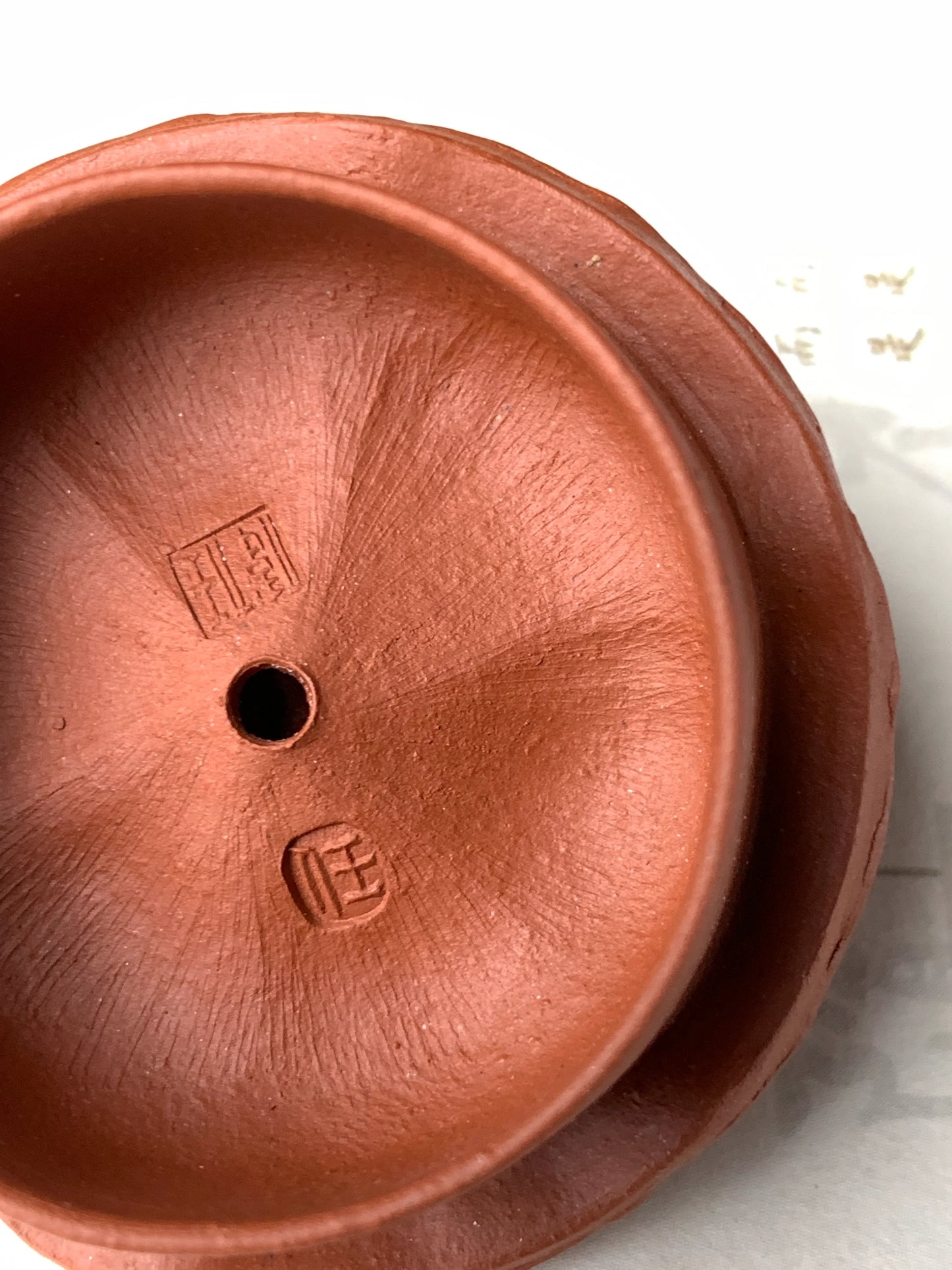 Photo of hand tool marks on the inside of the teapot lid