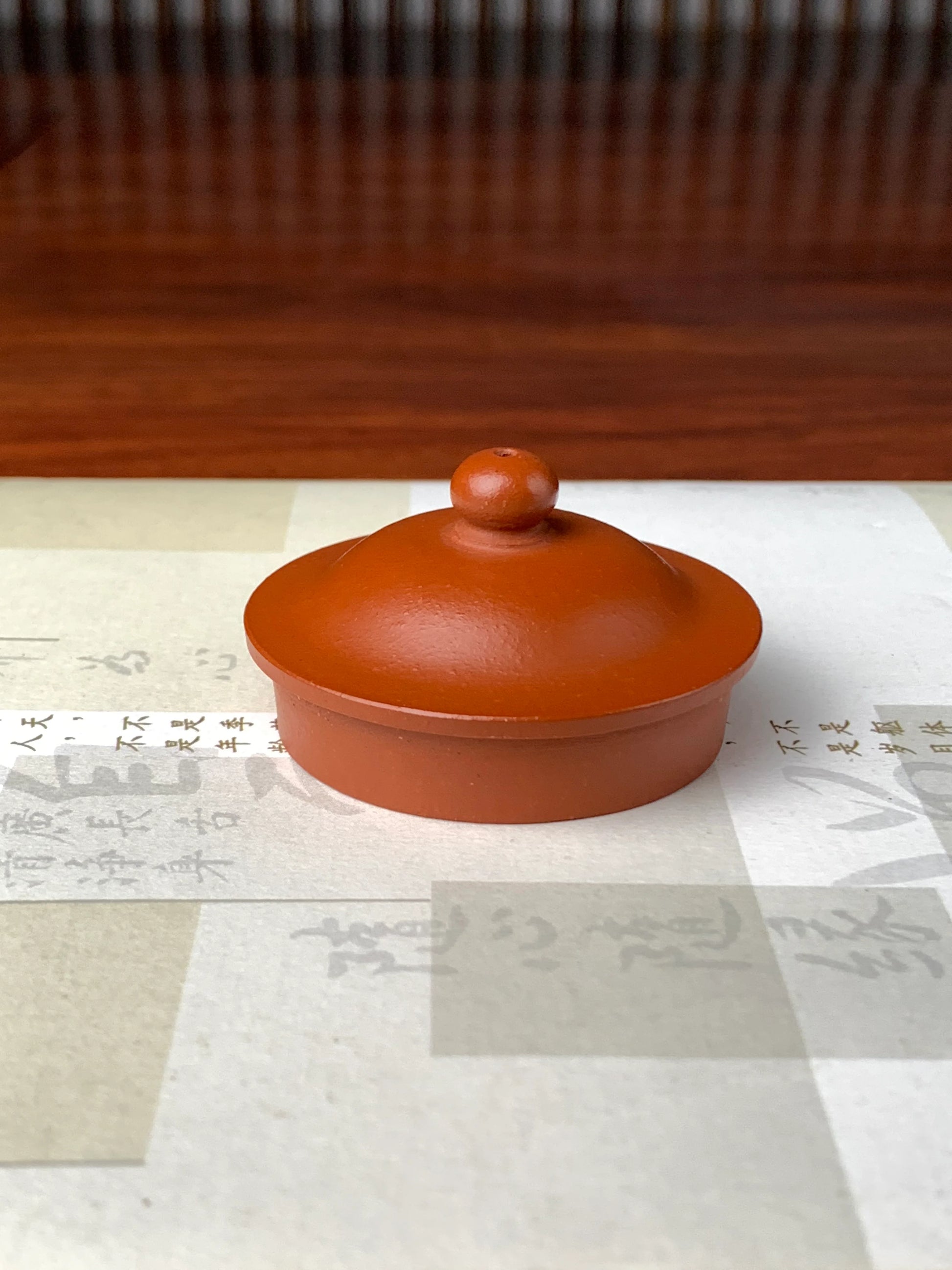 the teapot lid on the table