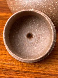 Tool marks left by handcrafting on the inside of the teapot lid