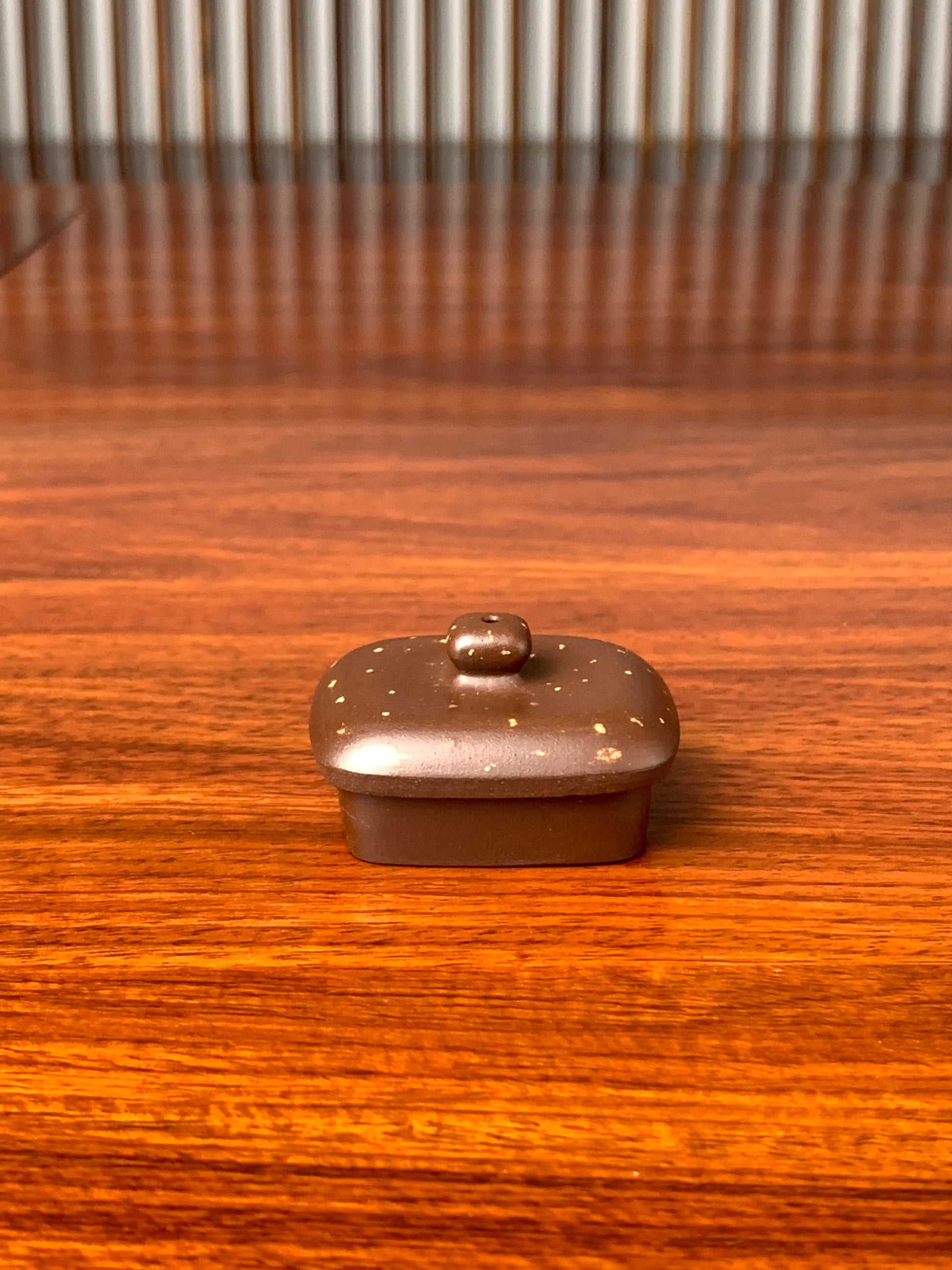 the teapot lid on the table