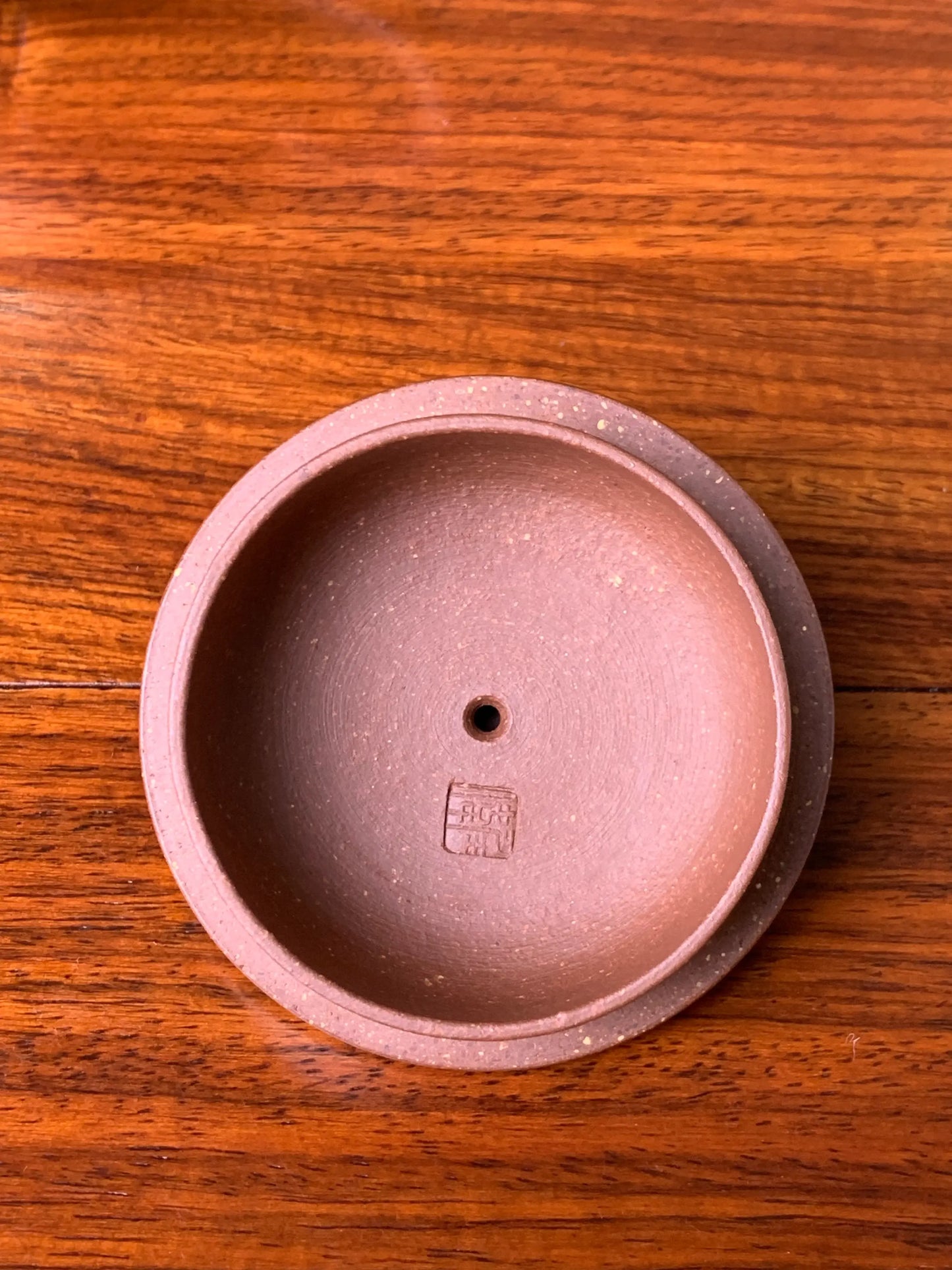 The inside of the teapot lid bears the seal of the teapot master