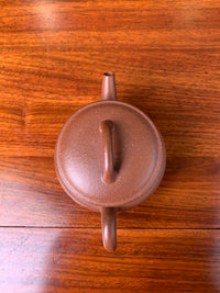 Looking down at this teapot from a close distance