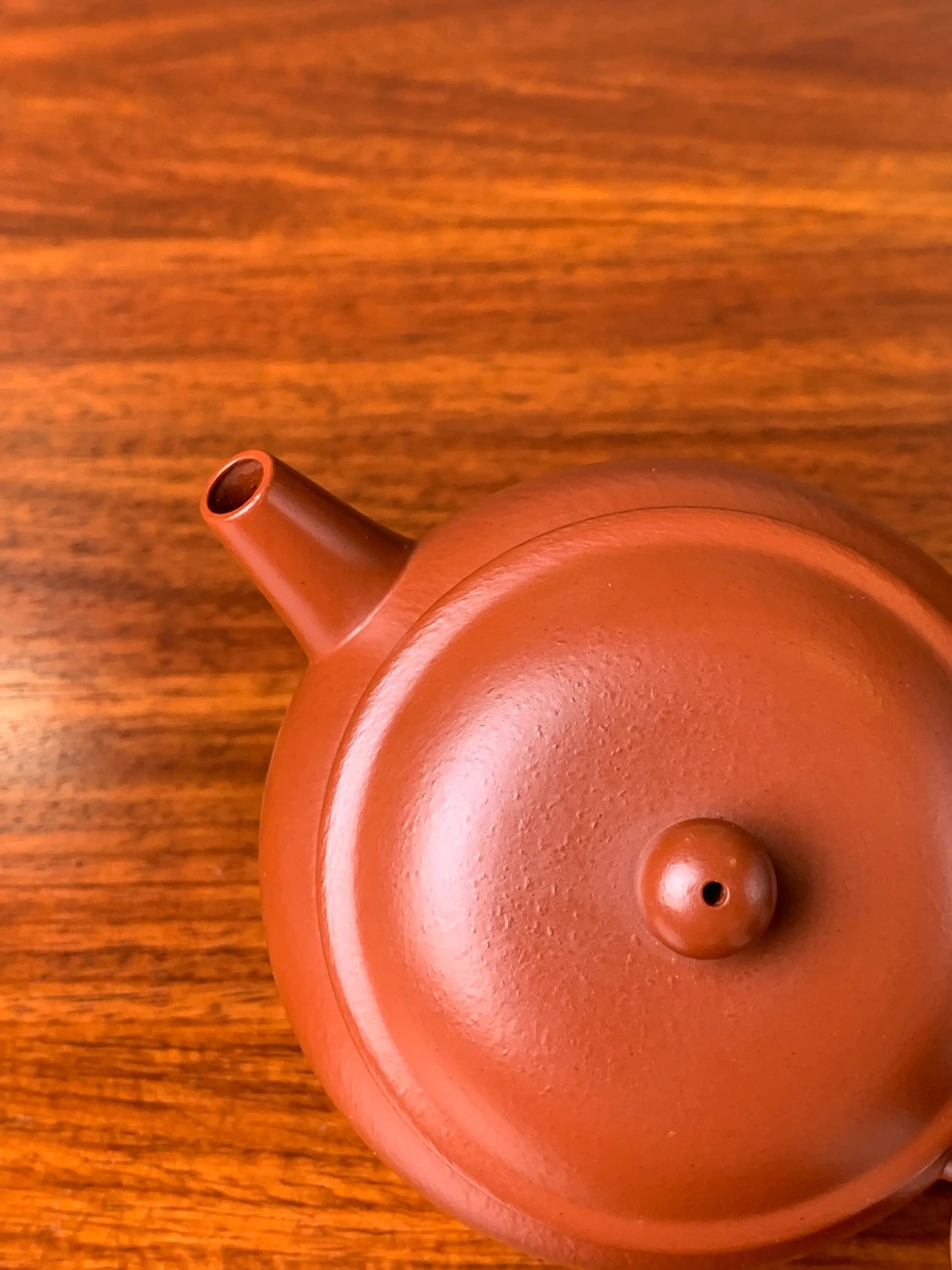 Top view of the teapot's spout and lid
