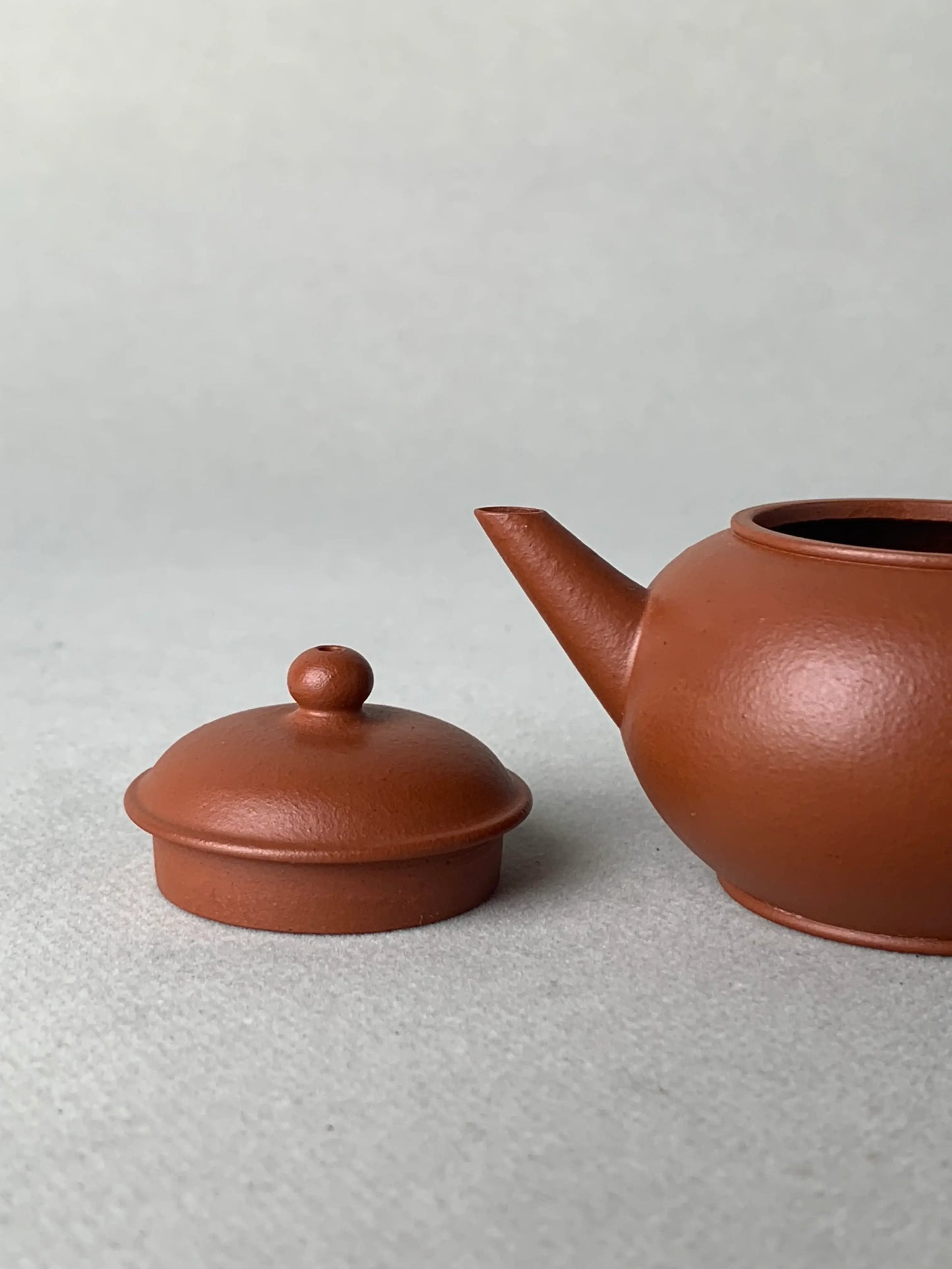 the lid and the teapot body on the table