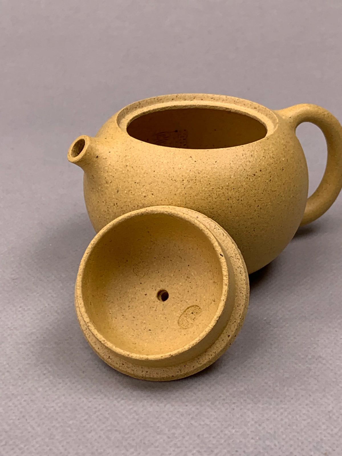 two teapot marks of potter sun in the lid
