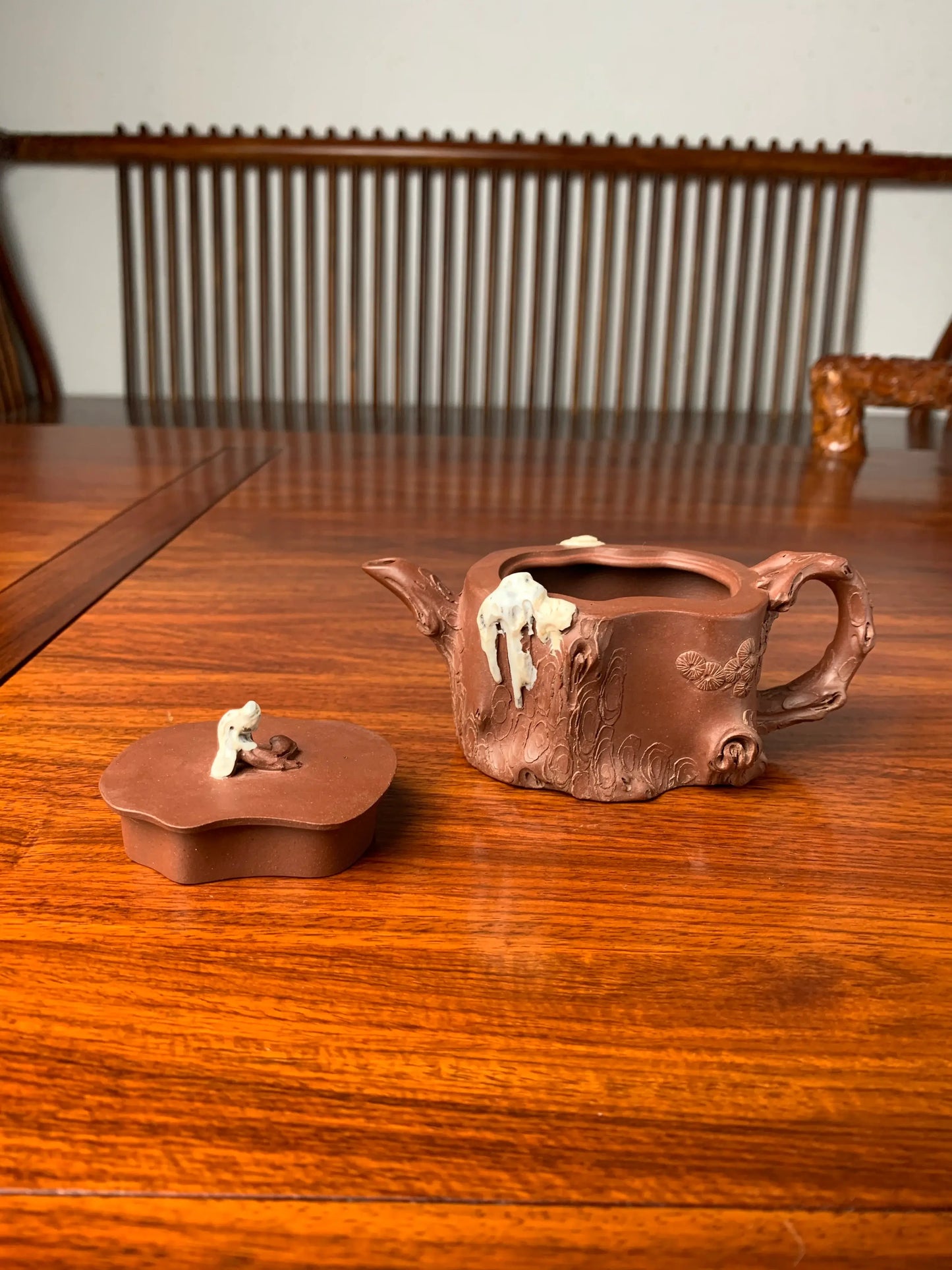 collectible teapot lid and teapot body on the table