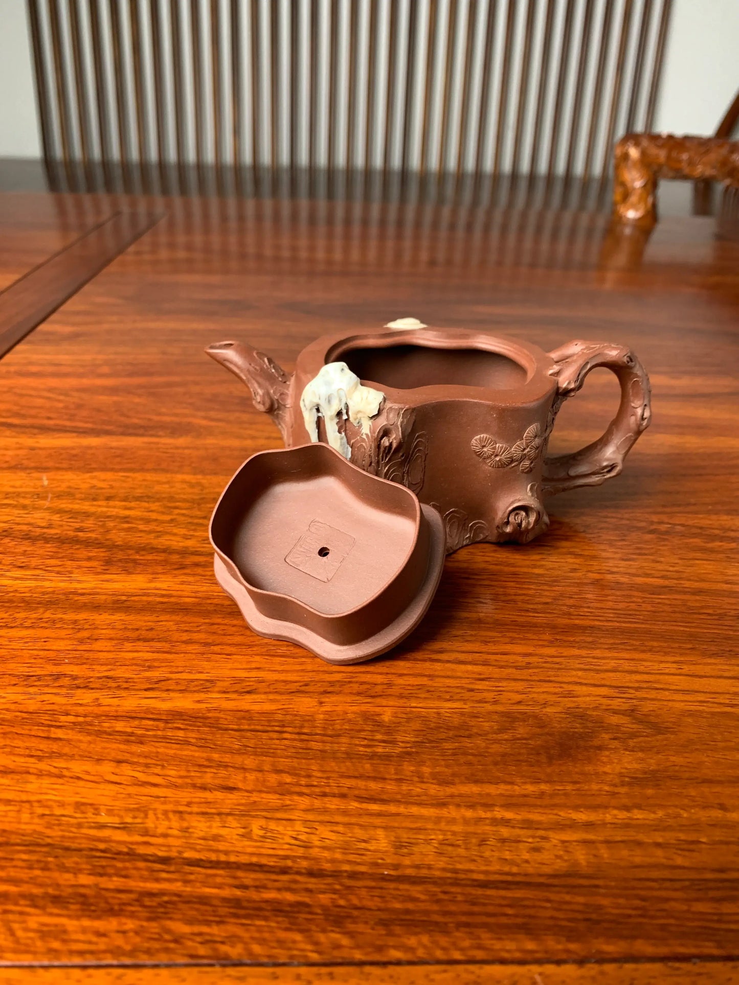 The teapot has the artist's seal on the inside of the lid