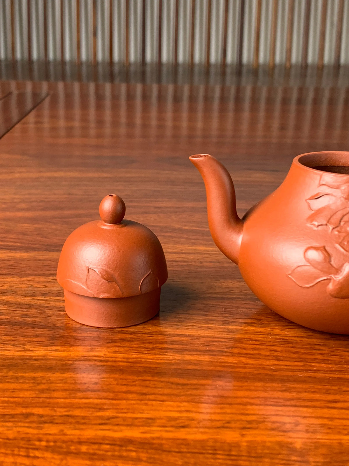 the lid and the spout of the handmade zisha clay teapot named si ting