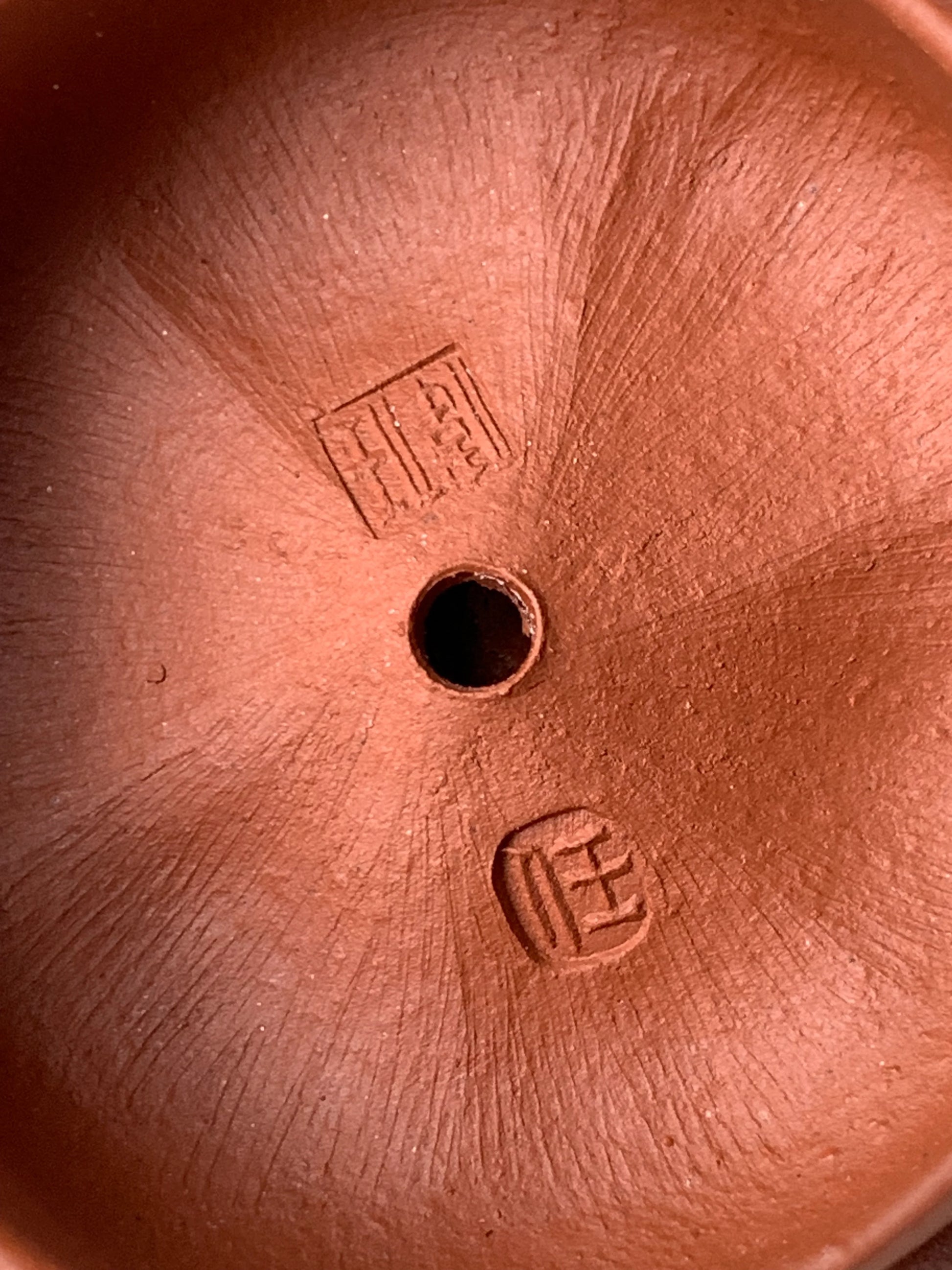 The inside of the teapot lid has the artist Wei Ren's mark