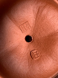 The inside of the teapot lid has the artist Wei Ren's mark
