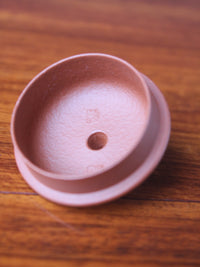 A closer look at the lid mark of this handmade teapot