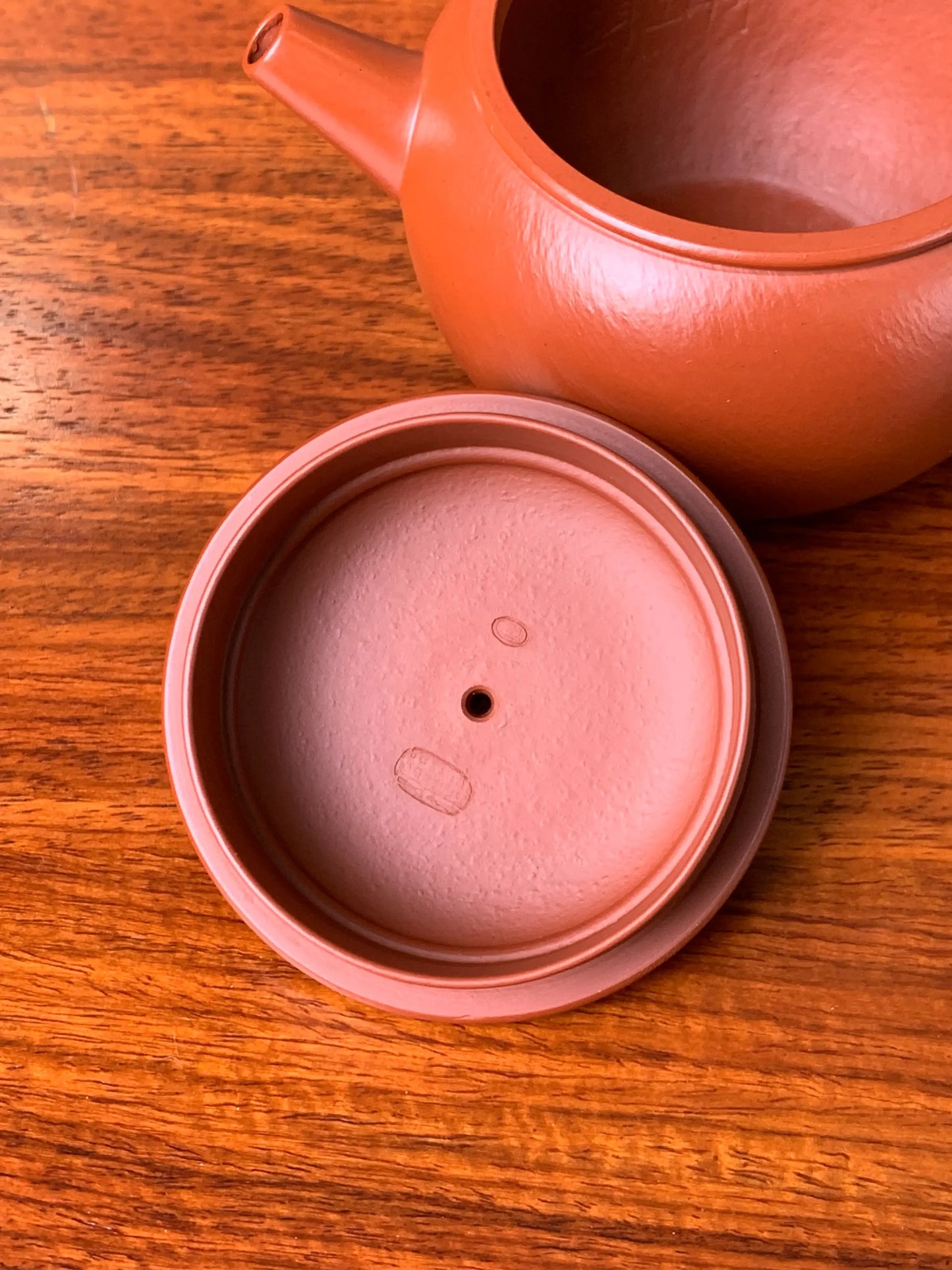 There are two seals inside the teapot from the master potter Wei Ren