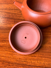 There are two seals inside the teapot from the master potter Wei Ren