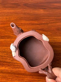 Looking down at the mouth of the collectible teapot
