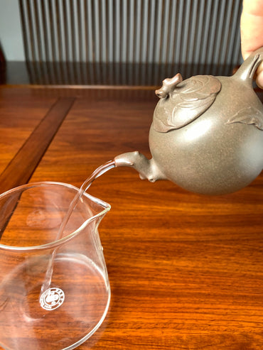 The handmade Yixing teapot made with Qing Duanni clay, pours very well.