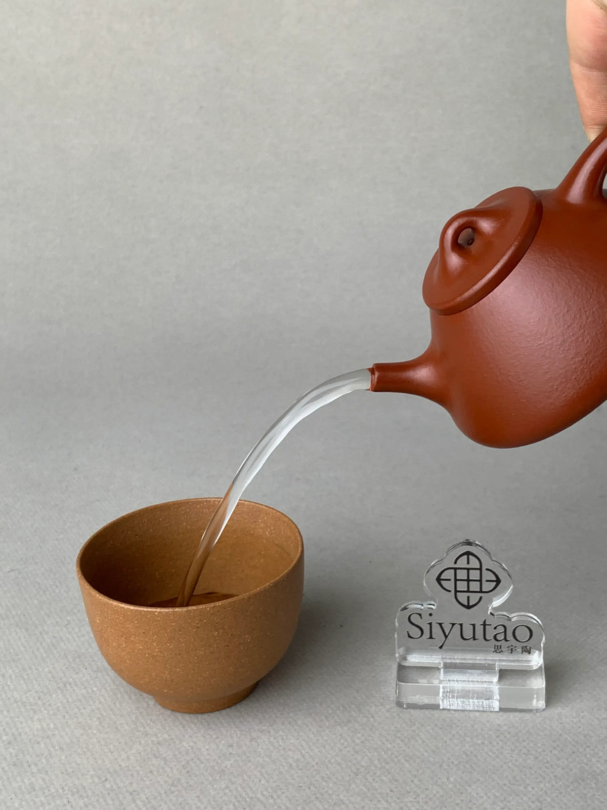 the pour of the yixing teapot zisha shi piao is perfect