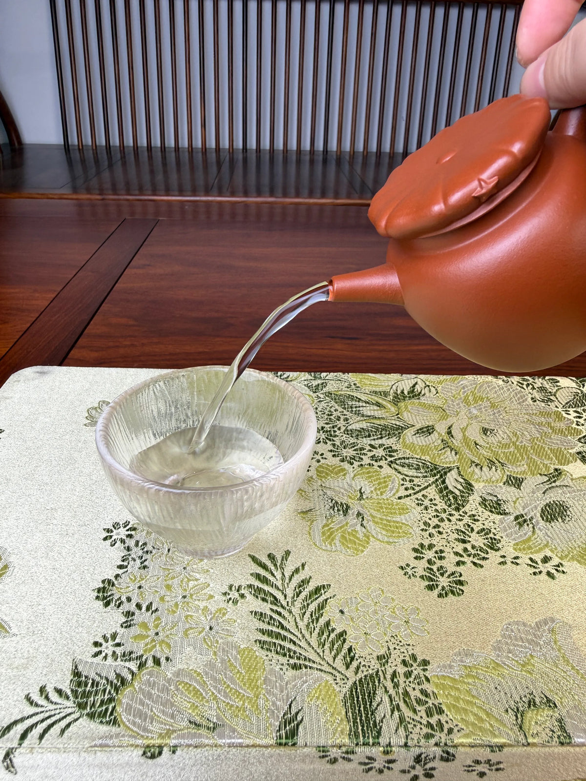 perfect pour of handmade yixing teapot jun hat