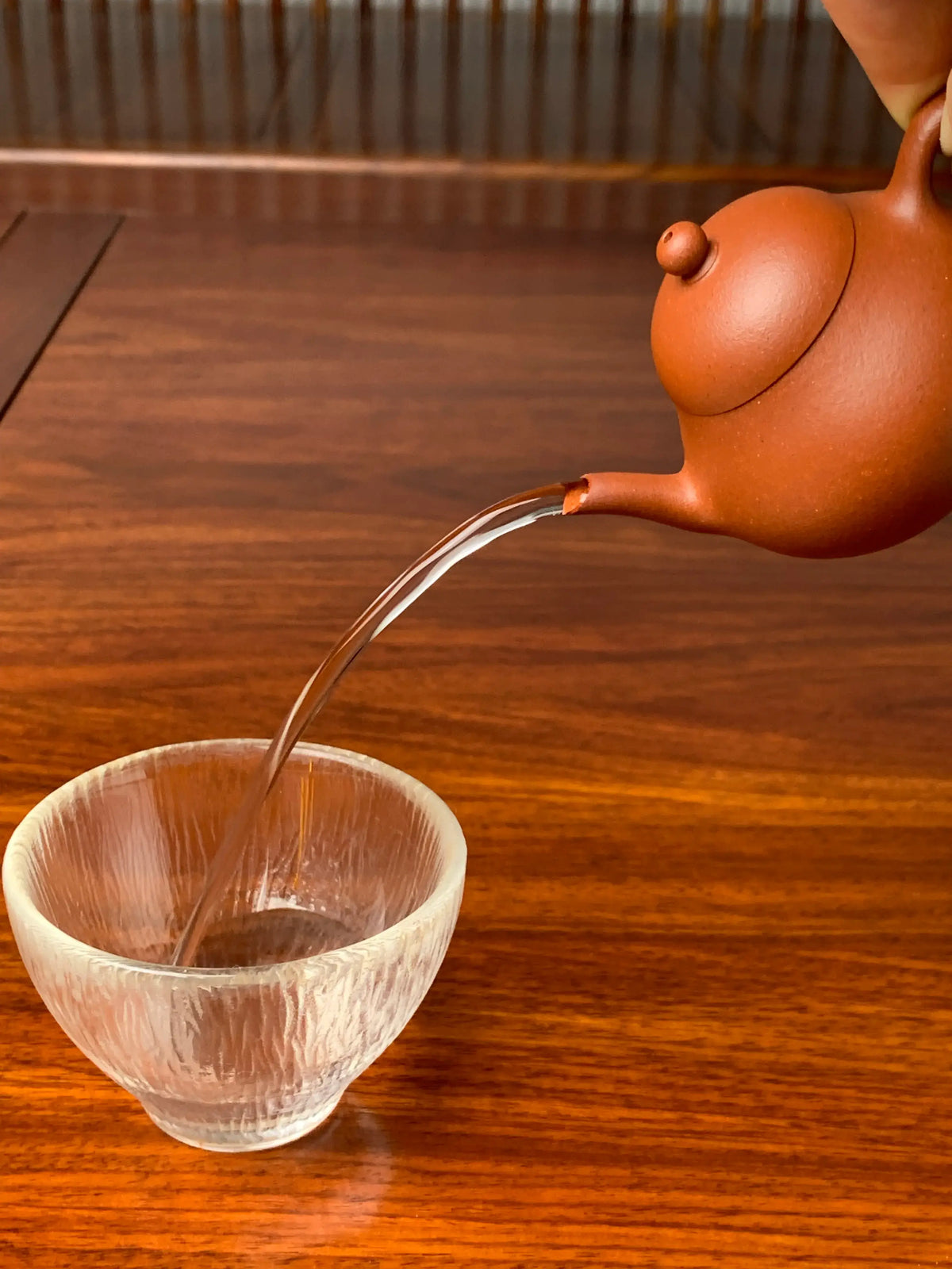 the pour of the small yixing teapot li xing is excellent
