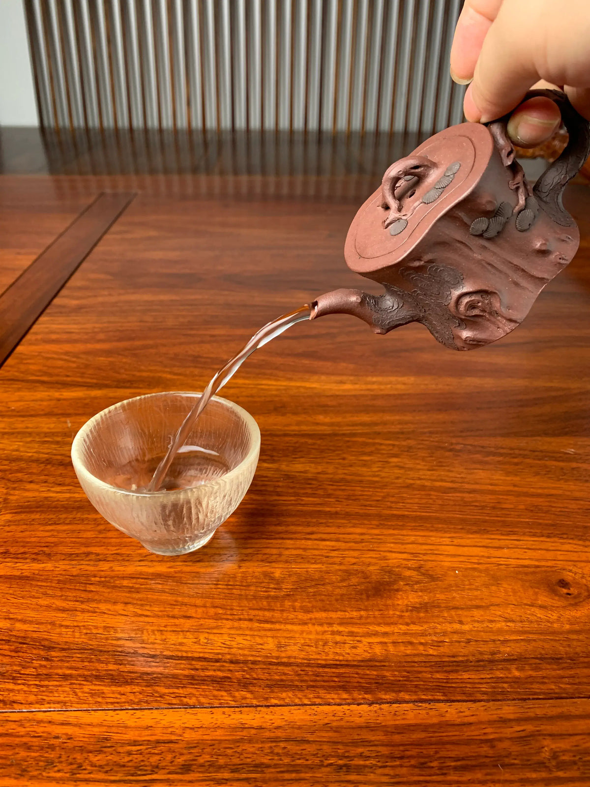 the perfect pour of the beautiful teapot named pine tree