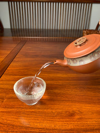 the perfect pour of the yixing zisha clay teapot named bring wealth