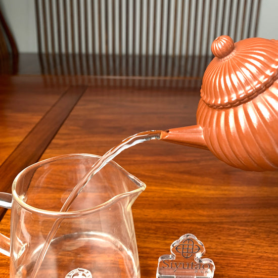 the pour of the handmade yixing teapot