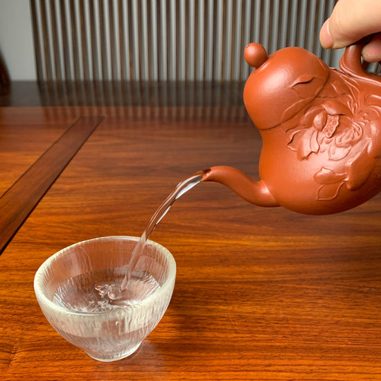 the perfect pour of the handmade zisha teapot named si ting