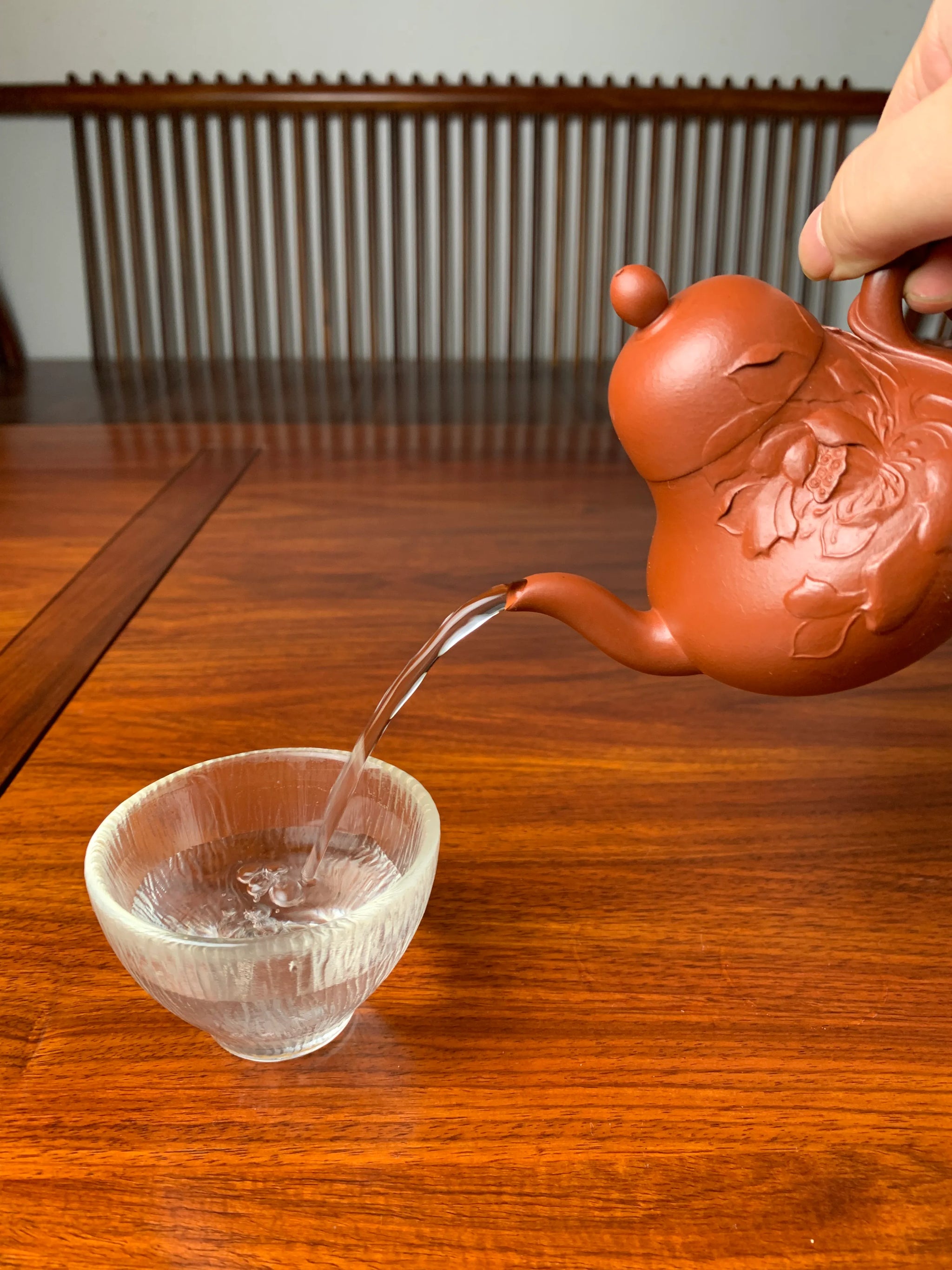 the perfect pour of the handmade zisha teapot named si ting