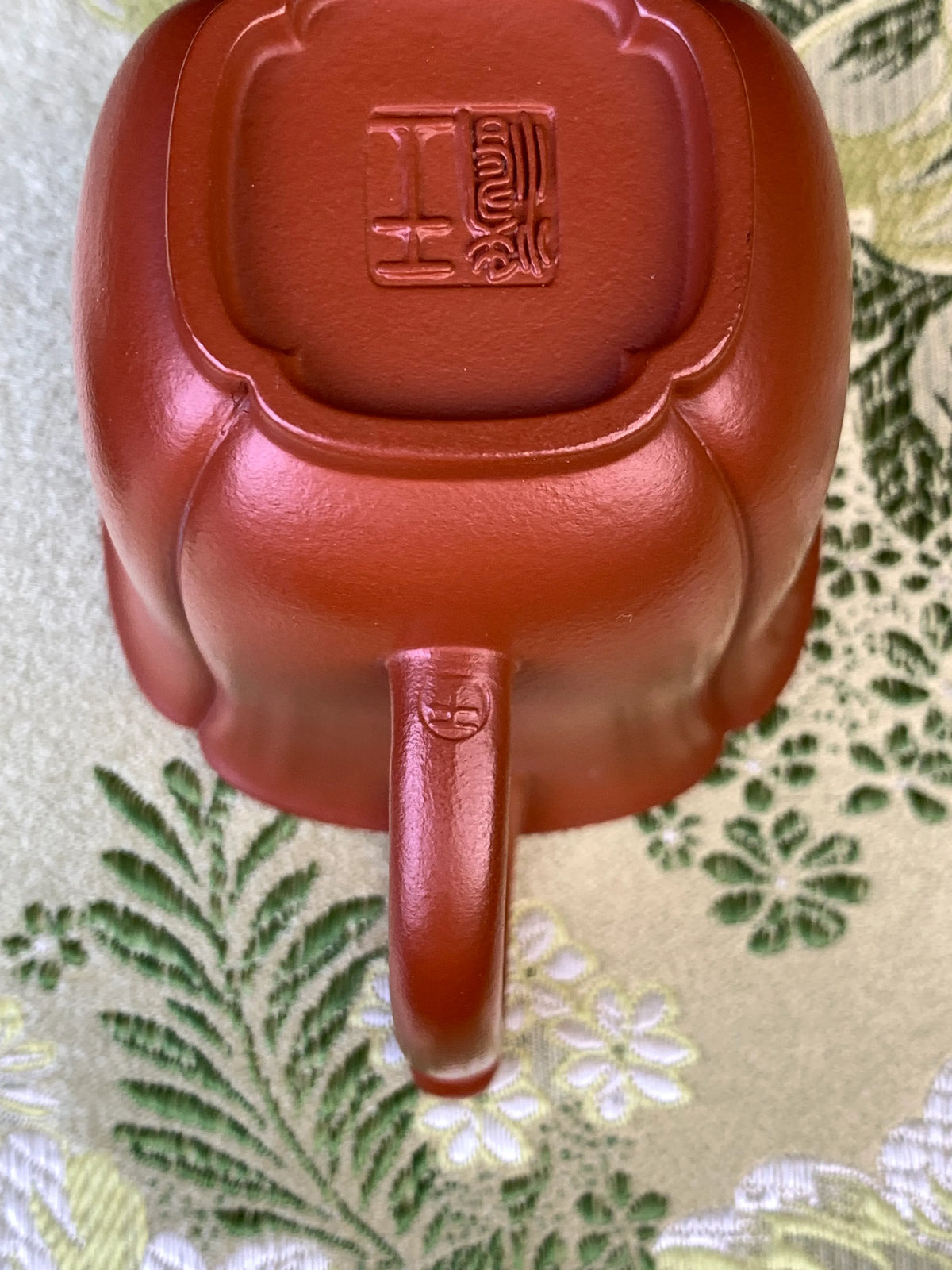 the teapot mark of potter wang tao on the handle