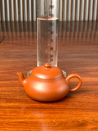 the size of the fully handmade yixing teapot is 125ml