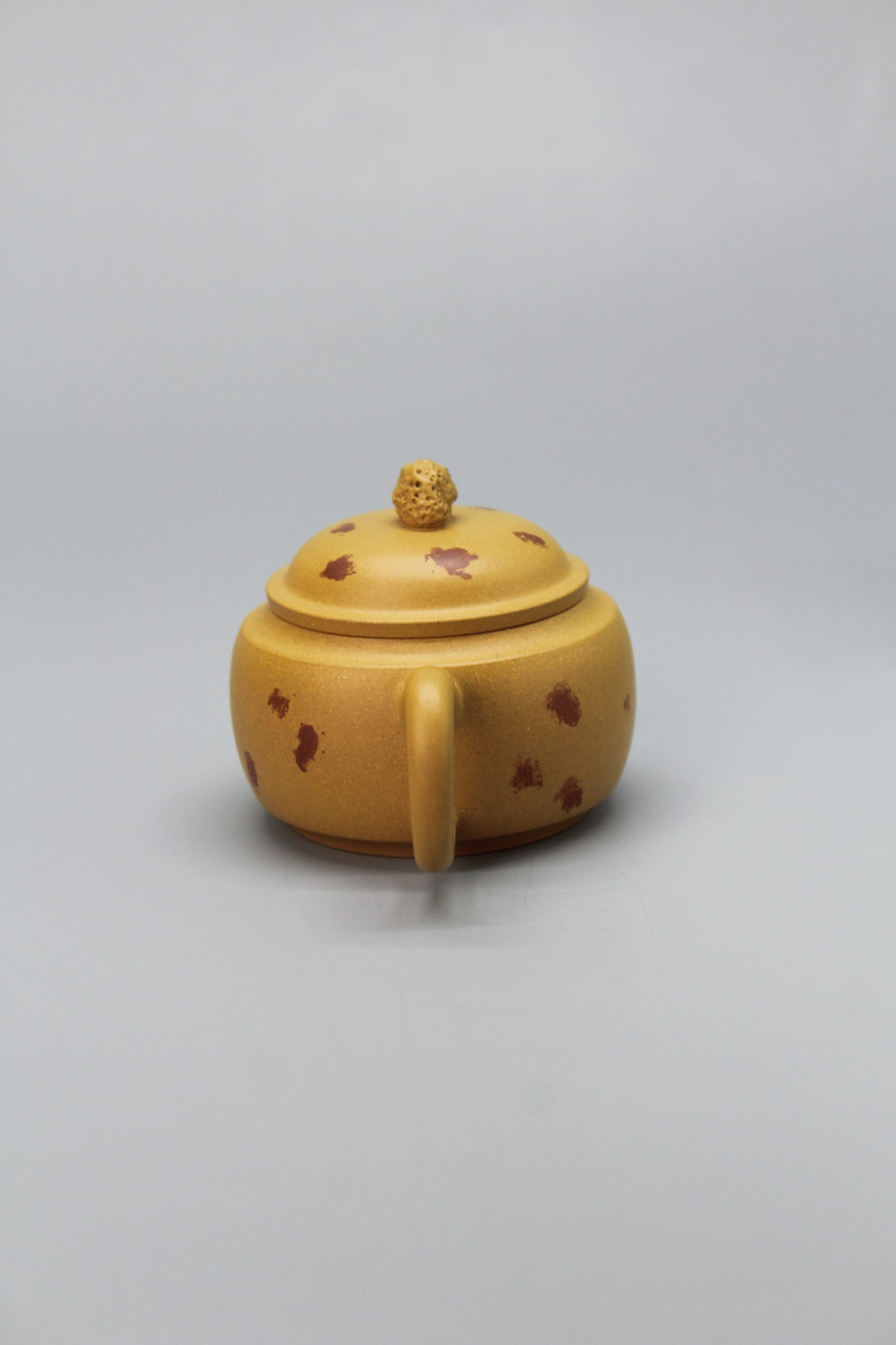 A cute small teapot for one handle