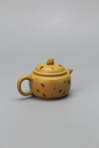 A cute small teapot for one back left