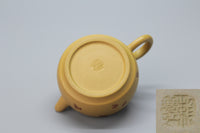 A cute small teapot for one bottom