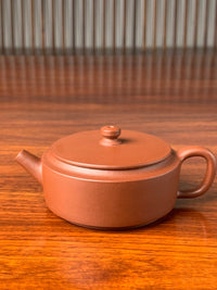 the small yixing teapot named han wa on the table