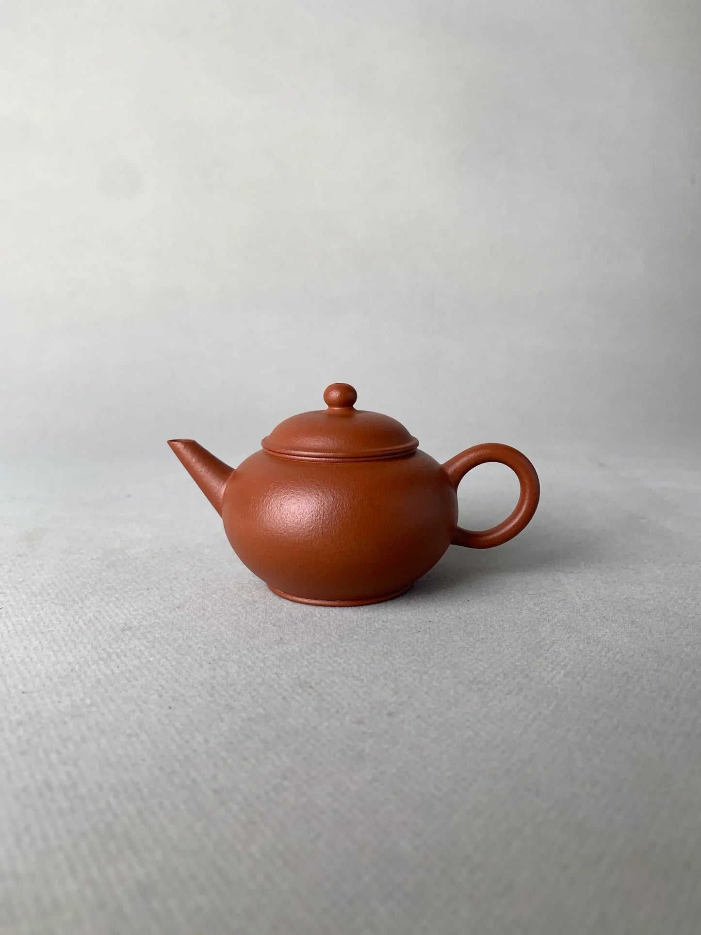 the front view of the small yixing teapot half handmade with zhu niclay