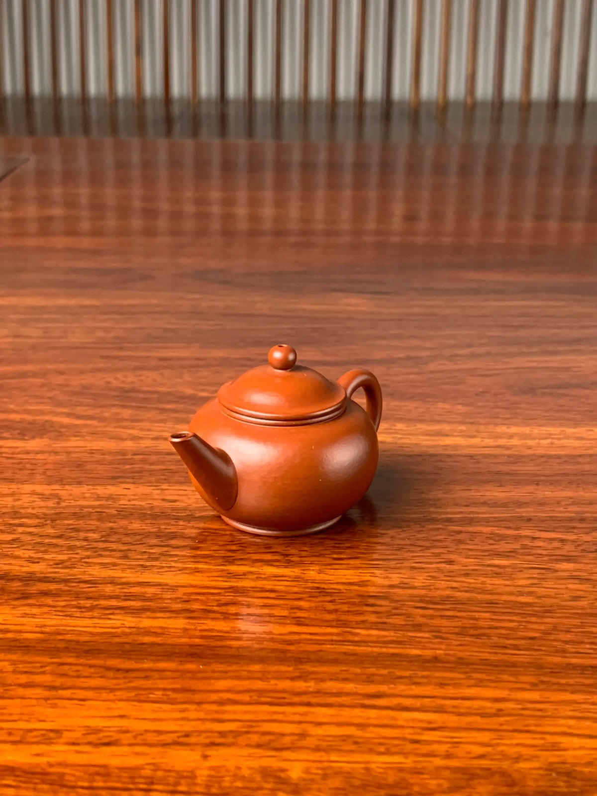 the right view of the small yixing teapot shui ping on the table