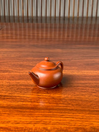 the right view of the small yixing teapot shui ping on the table