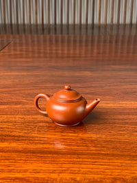 the left view of the small yixing teapot shui ping on the table