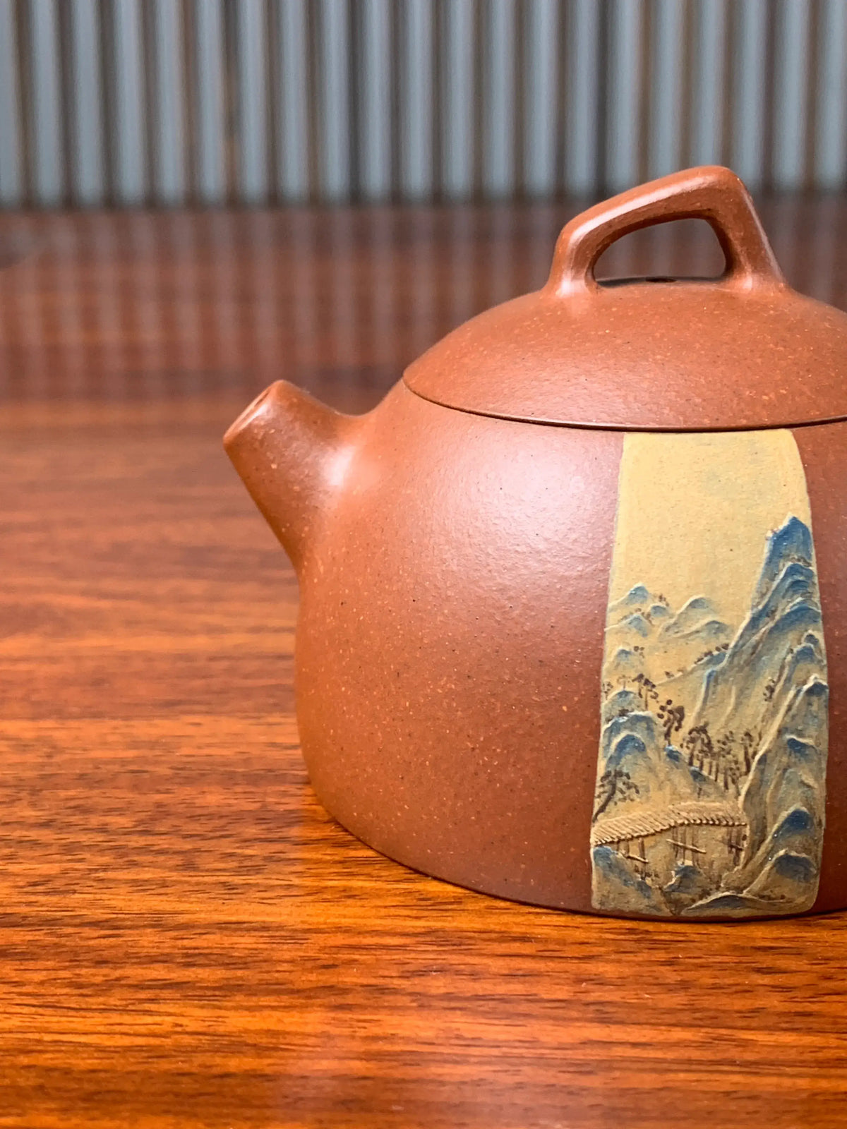 the spout of the teapot artwork on the table