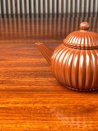 the spout of the handmade yixing teapot named shui ping
