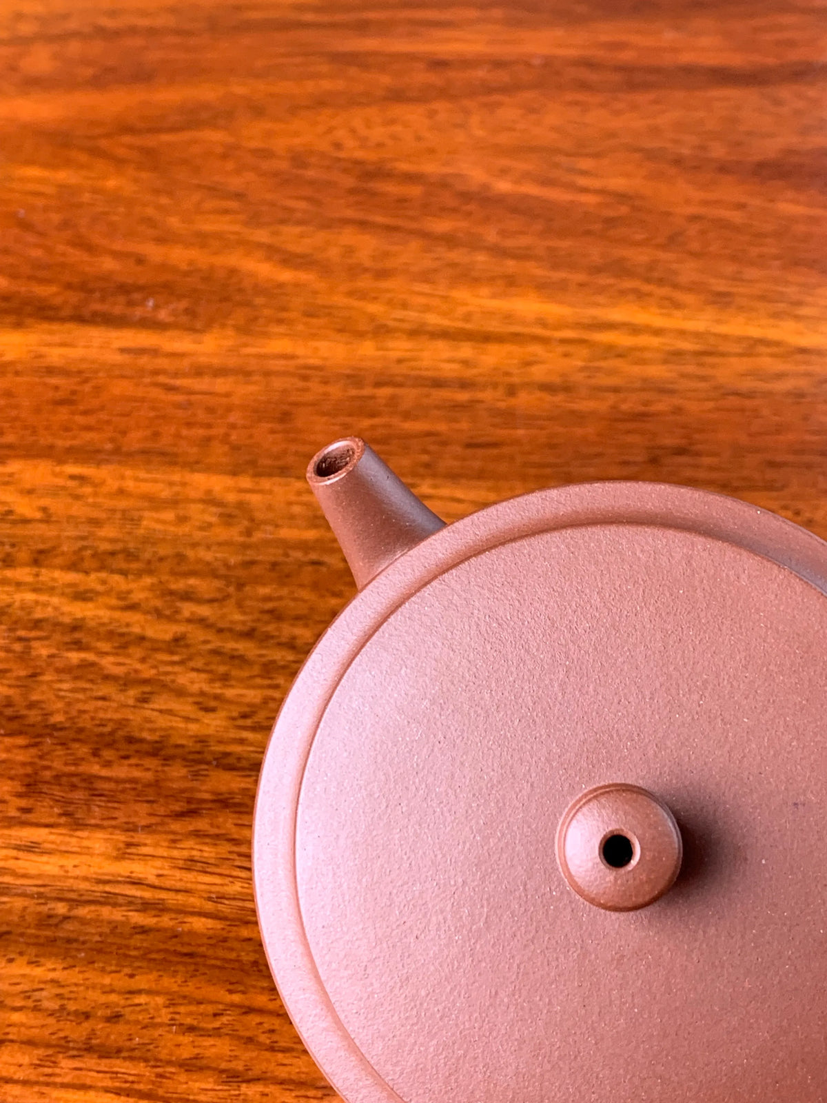 the spout and the lid of the small yixing teapot